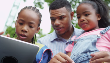 African American Family using laptop